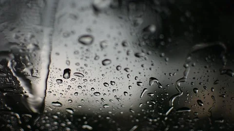 Raindrops falling on windscreen Stock Footage 129436716