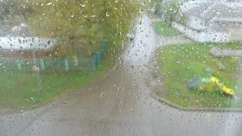 Raindrops falls on heavily misted window and flows down Stock Footage 194946904