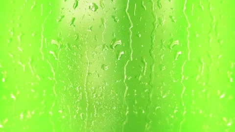 Raindrops flow across the green screen Stock Footage 242098299
