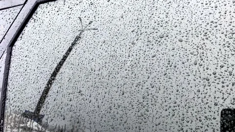 Raindrops flow down the car window Video stock 168072536