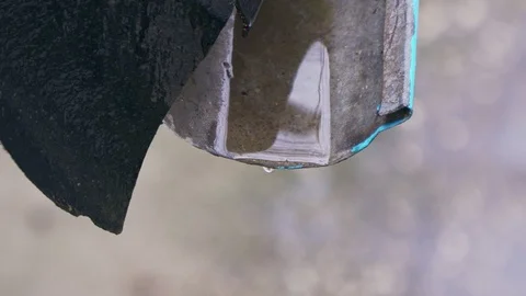 Raindrops flow down the drain closeup Stock Footage 103472682