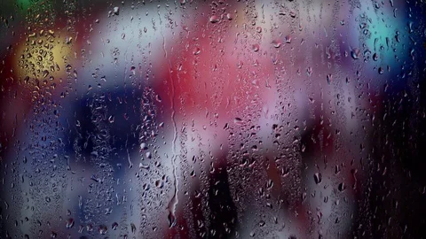 Raindrops flow down the glass on the window against the background of ambulance  Stock Footage 127300259