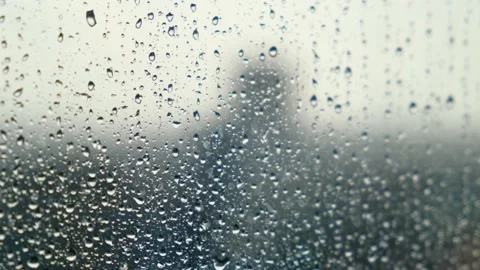 Raindrops flow down the window on a cloudy gloomy day Stock Footage 221559602
