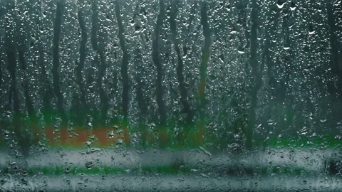 Raindrops Flow Down the Window Glass in Cloudy Weather Stock Footage 260504081