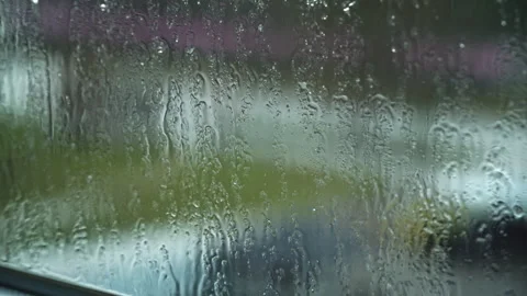 Raindrops Flow Down the Window Glass in Cloudy Weather Stock Footage 263232551