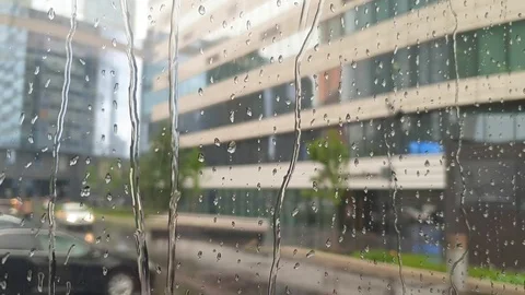 Raindrops Flow Through The Glass Window. Bad Weather In The City. Stock Footage 112284658