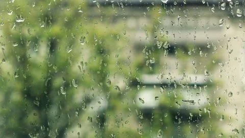 Raindrops flowing on the  window Stock Footage 75668673