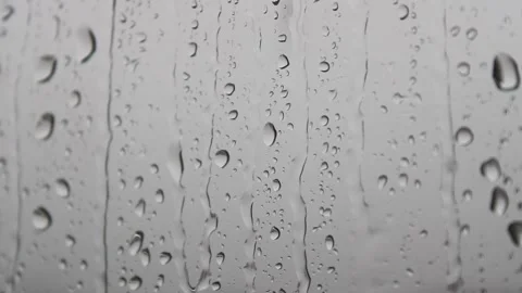 Raindrops  flowing on the window Stock Footage 141187965