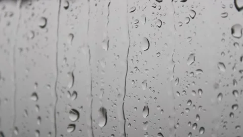 Raindrops  flowing on the window Stock Footage 141188080