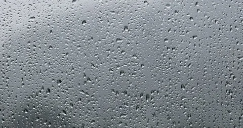 Raindrops flows on wet rainy window Stock Footage 122706957