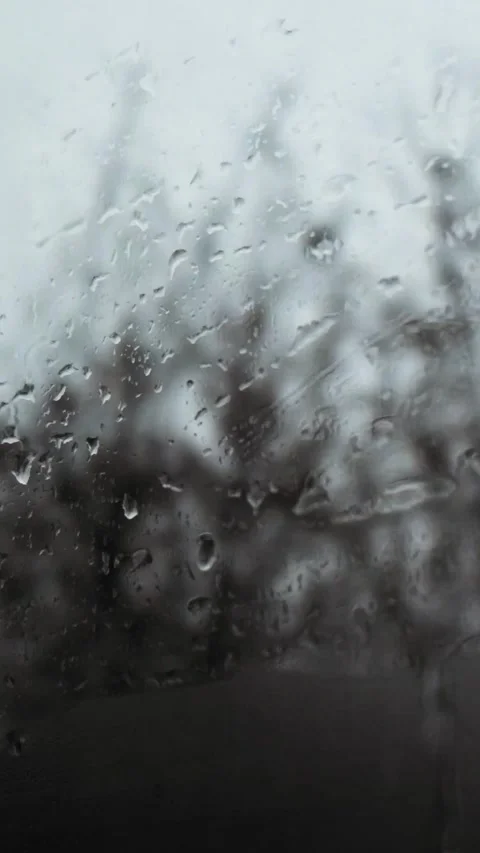 Raindrops on foggy side window of car during rain or sleet Stock Footage 346019040
