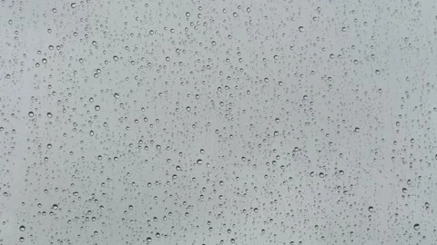Raindrops on glass background 4K Stock Footage 206305336