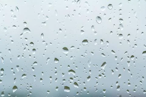 Raindrops on glass as a background Stock Photos