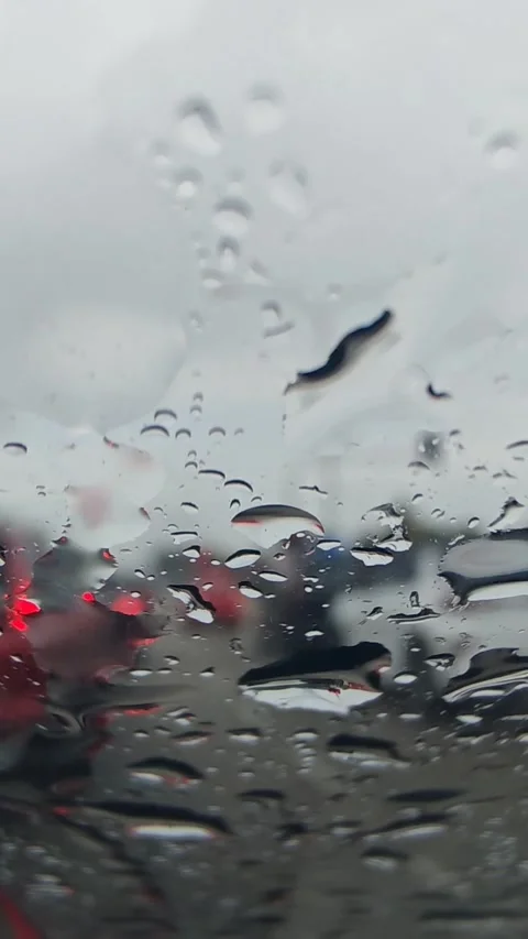 Raindrops on Glass with Blurred Traffic Background Video stock 338044959