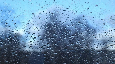 Raindrops on glass close-up on the background of the sky Stock Footage 167798108