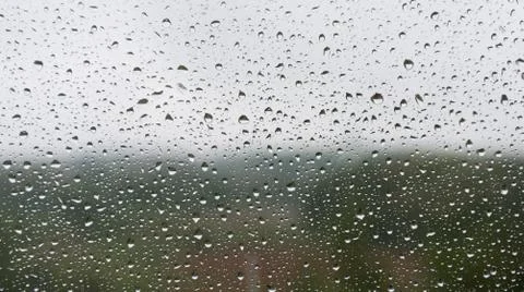 Raindrops on the glass close-up. Background, texture. Bad weather. Stock Photos