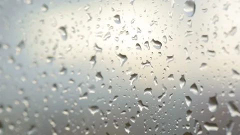 Raindrops on glass in closeup Stock Footage 102850369