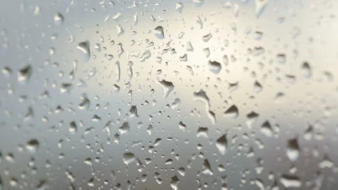 Raindrops on glass in closeup Stock Footage 102850420