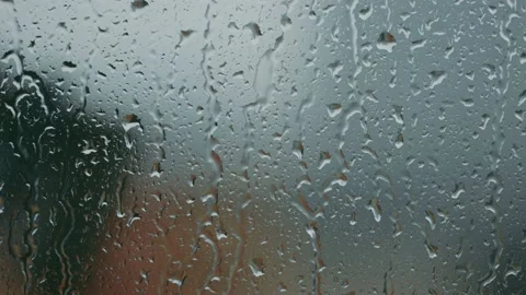 Raindrops on glass in closeup Video stock 130892288