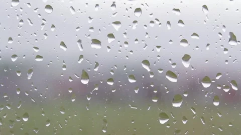 Raindrops on glass in a grey cloudy day Stock Footage 156035232
