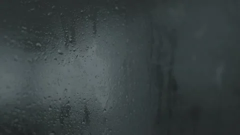 Raindrops on glass at night Stock Footage 201267178