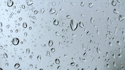 Raindrops on glass in slow motion Stock Footage 93782487