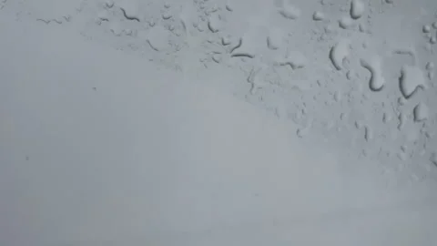 Raindrops On Glass Surface With Cinematic Gray Sky Background Stock Footage 341401501