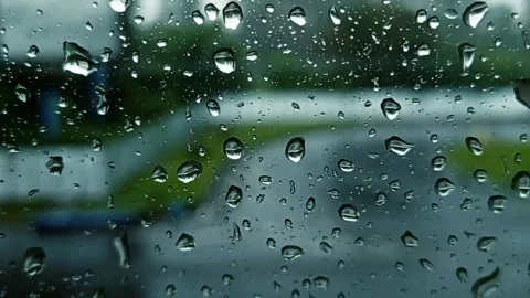 Raindrops on a glass surface, close - up. 스톡 동영상 306719217