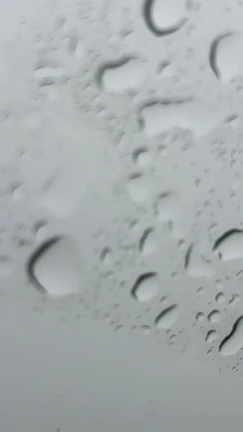 Raindrops On Glass Window Close Up Vertical Macro Stock Footage 341416973
