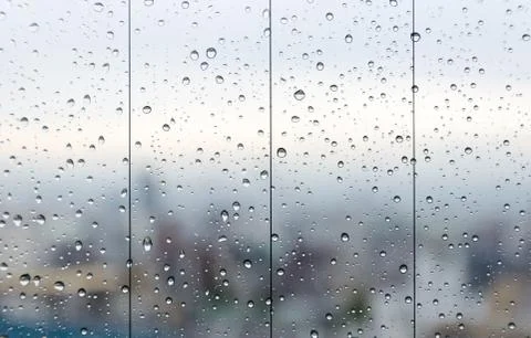 Raindrops on glass window Stock Photos