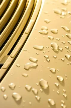 Raindrops on gold Stock Photos