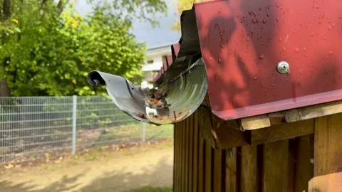 Raindrops from a Gutter After Rain Stock Footage 318849571
