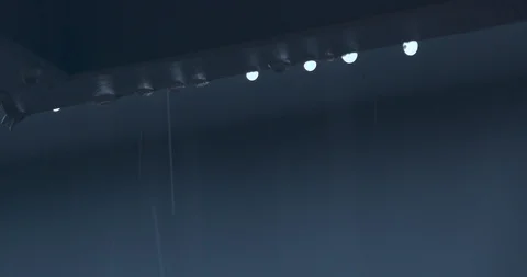 Raindrops on the Gutter of a House as it Continues to Rain in the Background Stock Footage 104262318