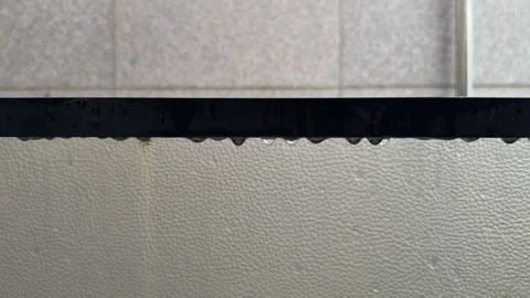 Raindrops Hanging on Black Metal Window Frame Close Up Stock Footage 338293194