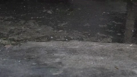 Raindrops hit the ground Stock Footage 201502570