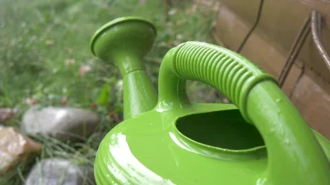 Raindrops Hitting Watering Can Outside In Calming Rain Storm - Close Up FHD Stock Footage 143161040