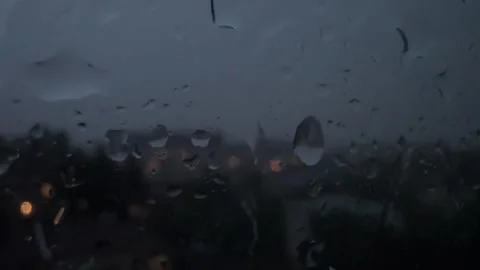 Raindrops hitting the window. thunder and lightning during a thunderstorm Vidéo 279581147
