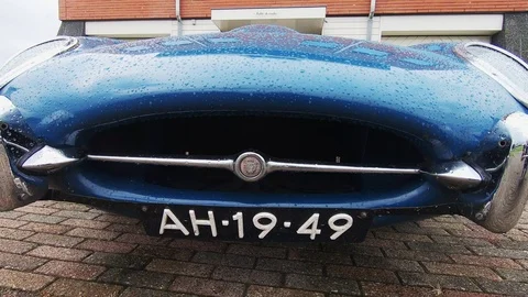 Raindrops on the Jaguar E-type 4.2 (1966) Stock Footage 116302946