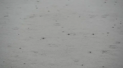 Raindrops on a lake surface in slow motion Stock Footage 53241280