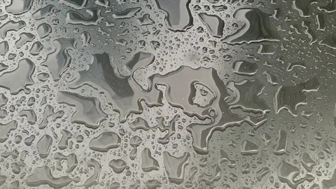 Raindrops make small puddles outside. bad weather in the city. Stock Footage 112284669