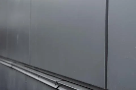 Raindrops on a metal wall. Stock Photos