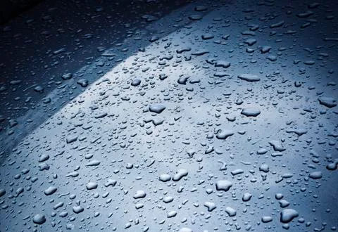 Raindrops on a metallic paint sheet Stock Photos