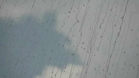 Raindrops motion on glass window Stock Footage 164516304