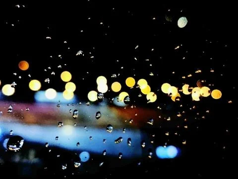 Raindrops On Night City Window Fotos Stock