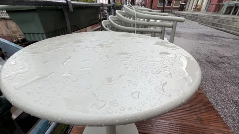 Raindrops on Outdoor Cafe Table After Rain Stock Footage 340442885