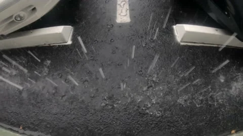 Raindrops on Parking Lot Pavement Stock Footage 200890951