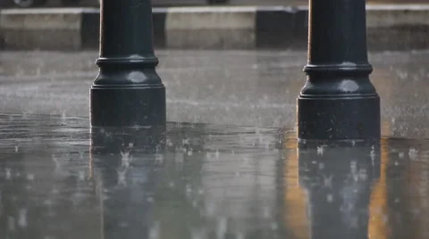 Raindrops on pavement Stock Footage 58607283
