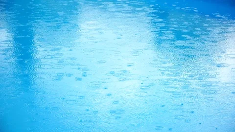 Raindrops on the pool.  Stock Footage 91865392