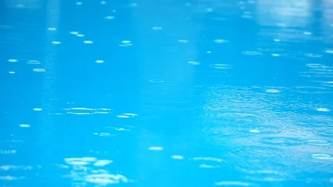 Raindrops on the pool, slow motion. Stock Footage 91865847