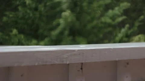 Raindrops on a rail Stock Footage 22289364